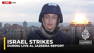 IsraelPalestine Conflict Tower hit behind Al Jazeera team [upl. by Berta]